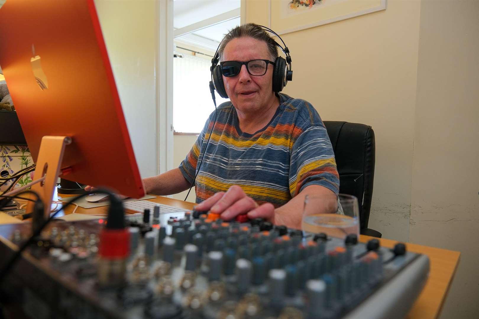 Podcaster Paul Allen in his home studio