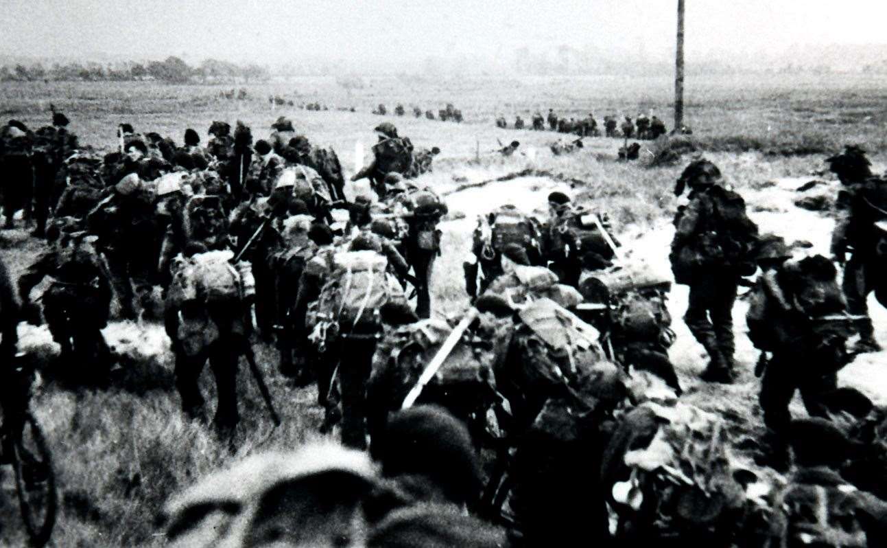 Royal Marine commandos advancing inland at Normandy. Credit: PA Photos / DPA, UK Use Only