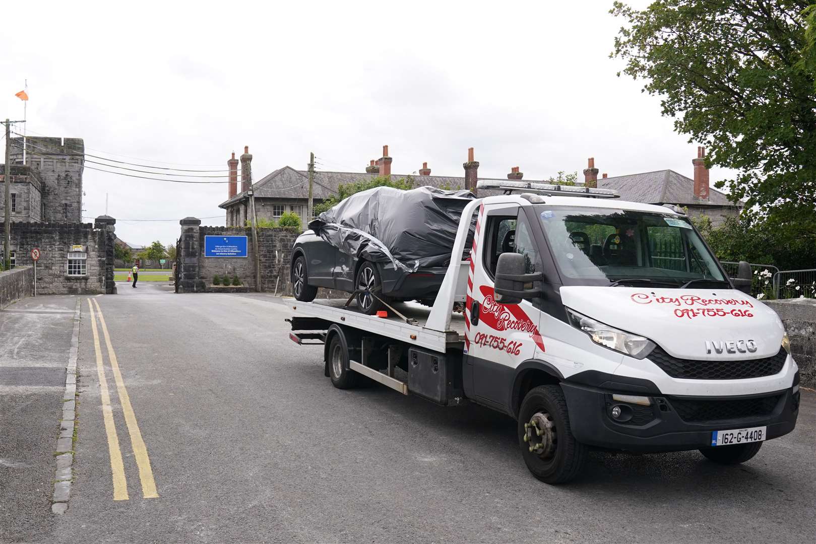 The car being removed from the scene (Brian Lawless/PA)
