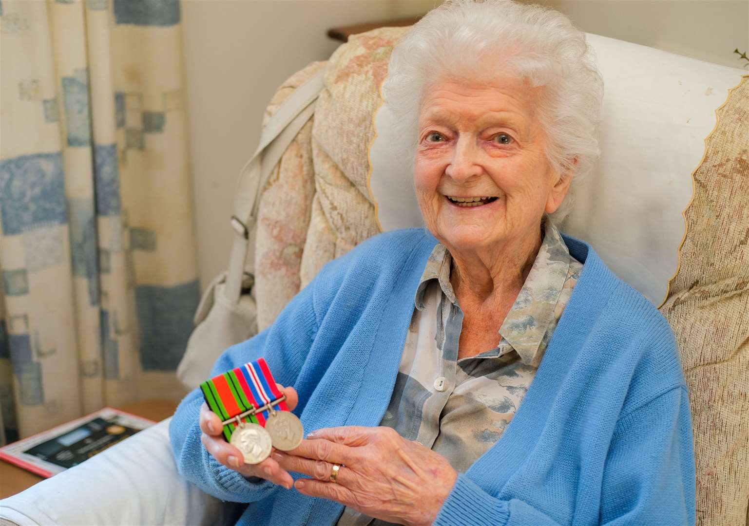99-year-old war veteran, Mary, with her medals