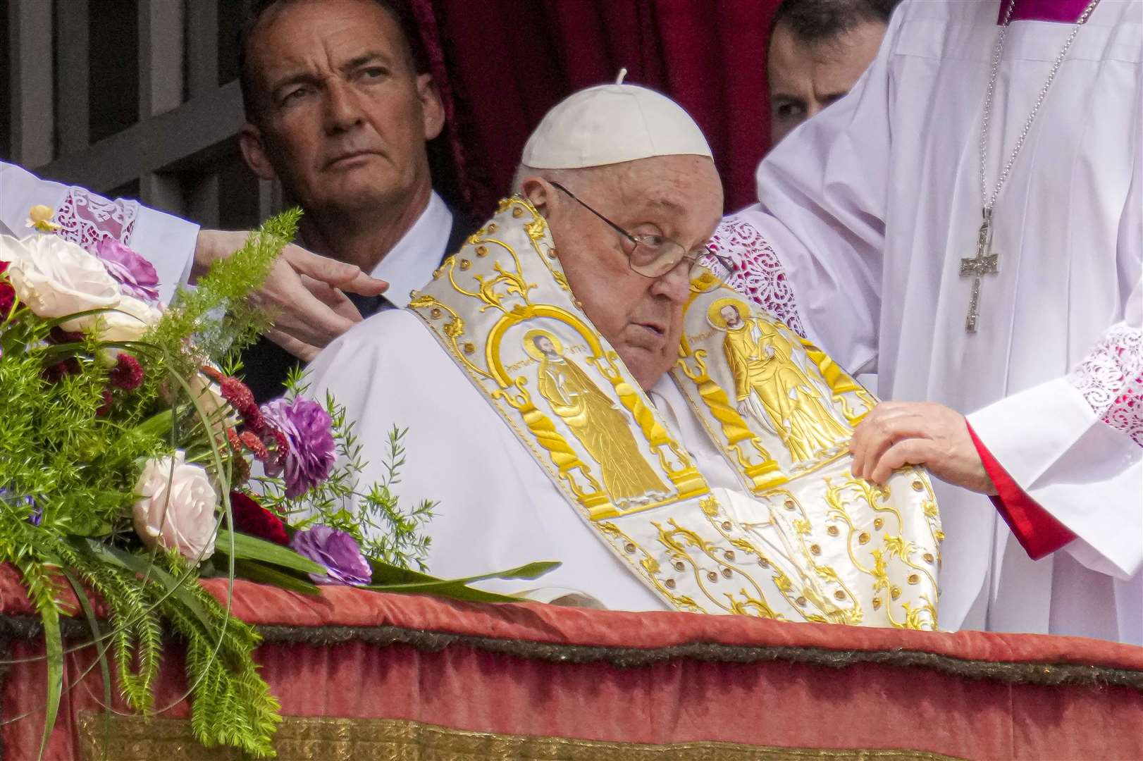 Pope Francis appears on the central lodge of St Peter’s Basilica to bestow the Urbi et Orbi (Latin for to the city and to the world) blessing at the end of the Easter mass on Sunday (Gregorio Borgia/AP)