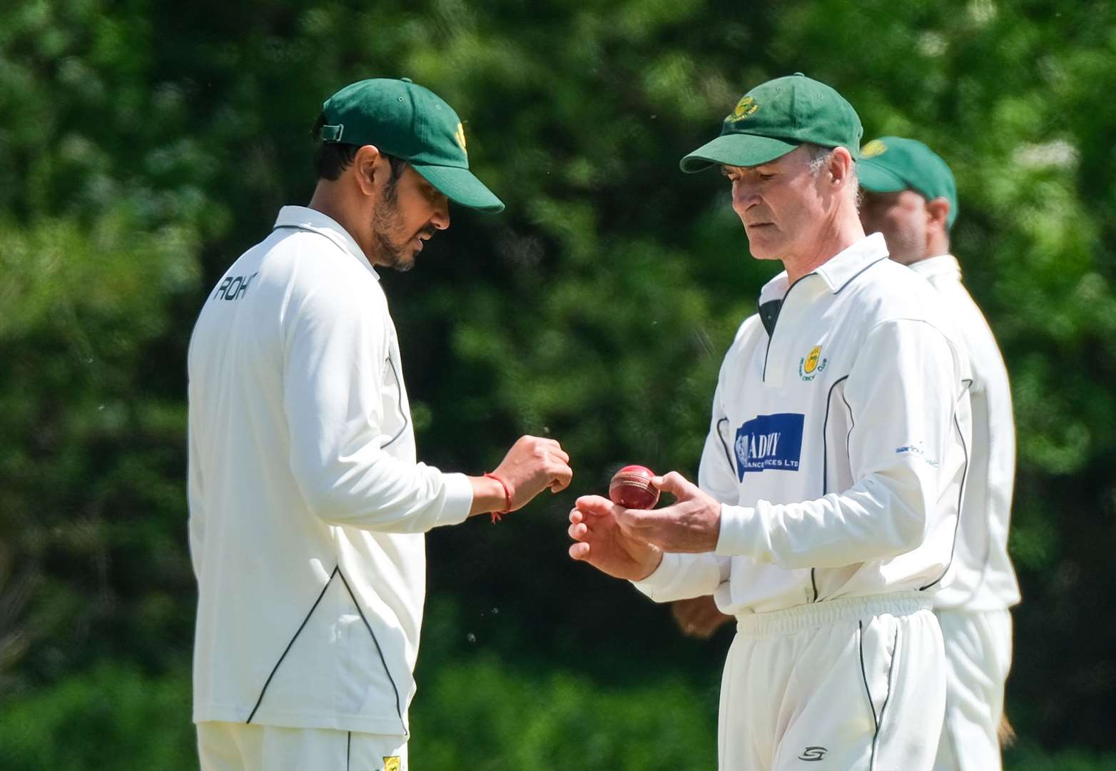 Charlie Anstey inspecting the ball