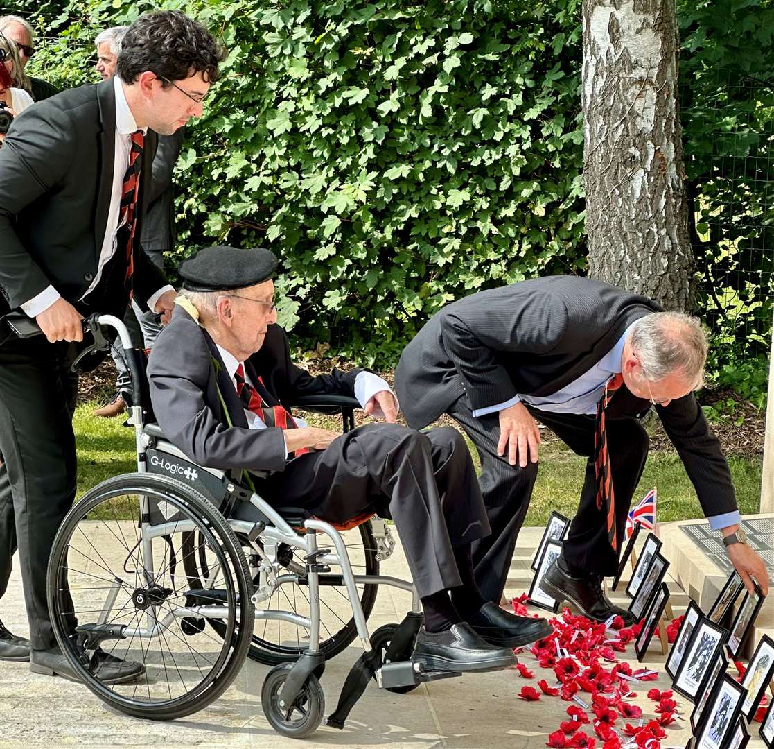 Cecil Newton and his son, Paul Newton, paying their respects at 4th/7th Royal Dragoon Guards Memorial in Creully. Credit: Mirek Gosney