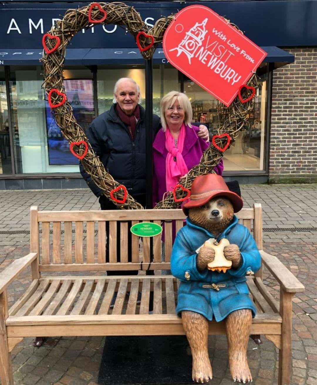 Couple Con and Nancy Fenton pose with the beloved bear