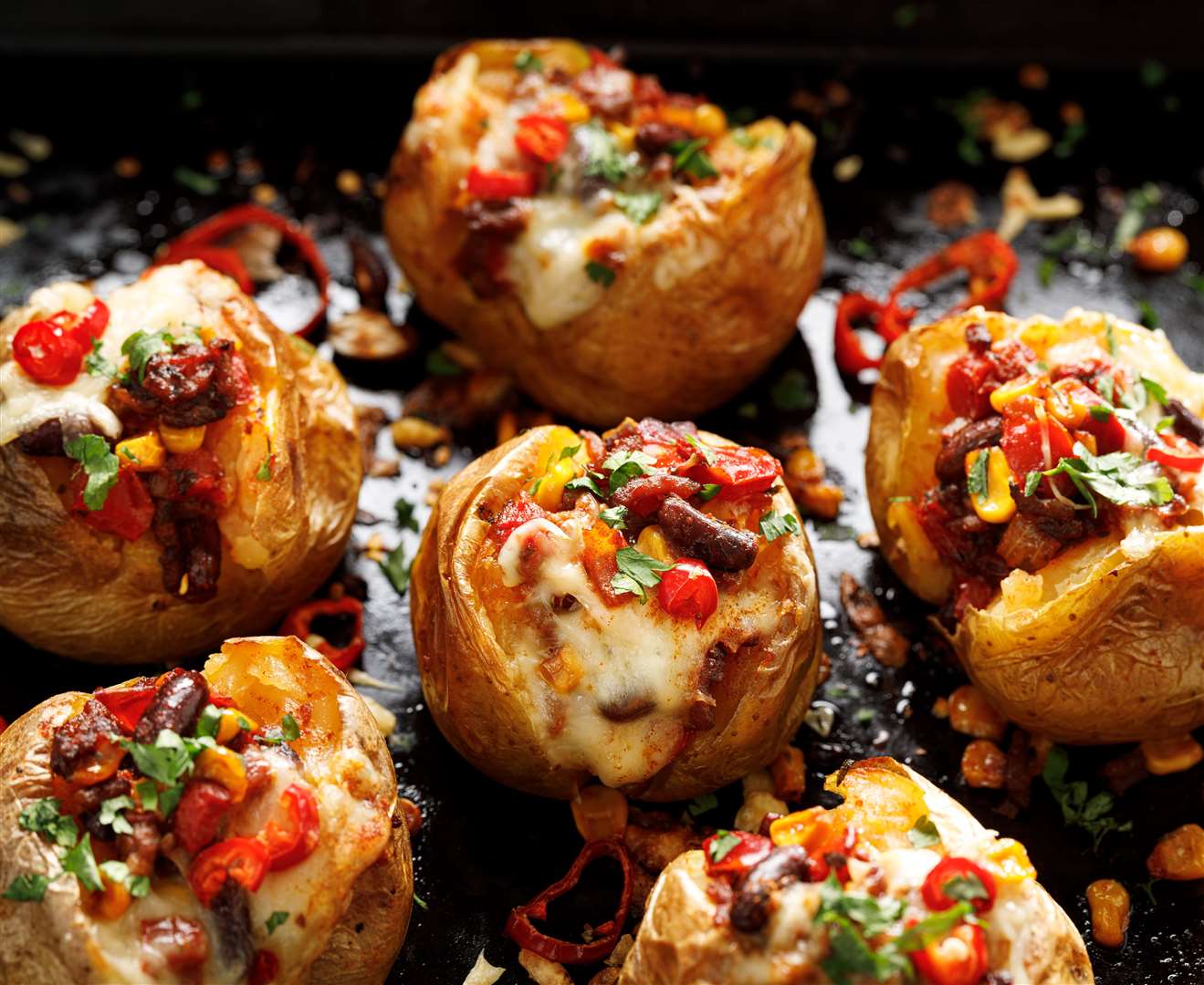 Mexican style baked potatoes with Chili con carne filling and cheese