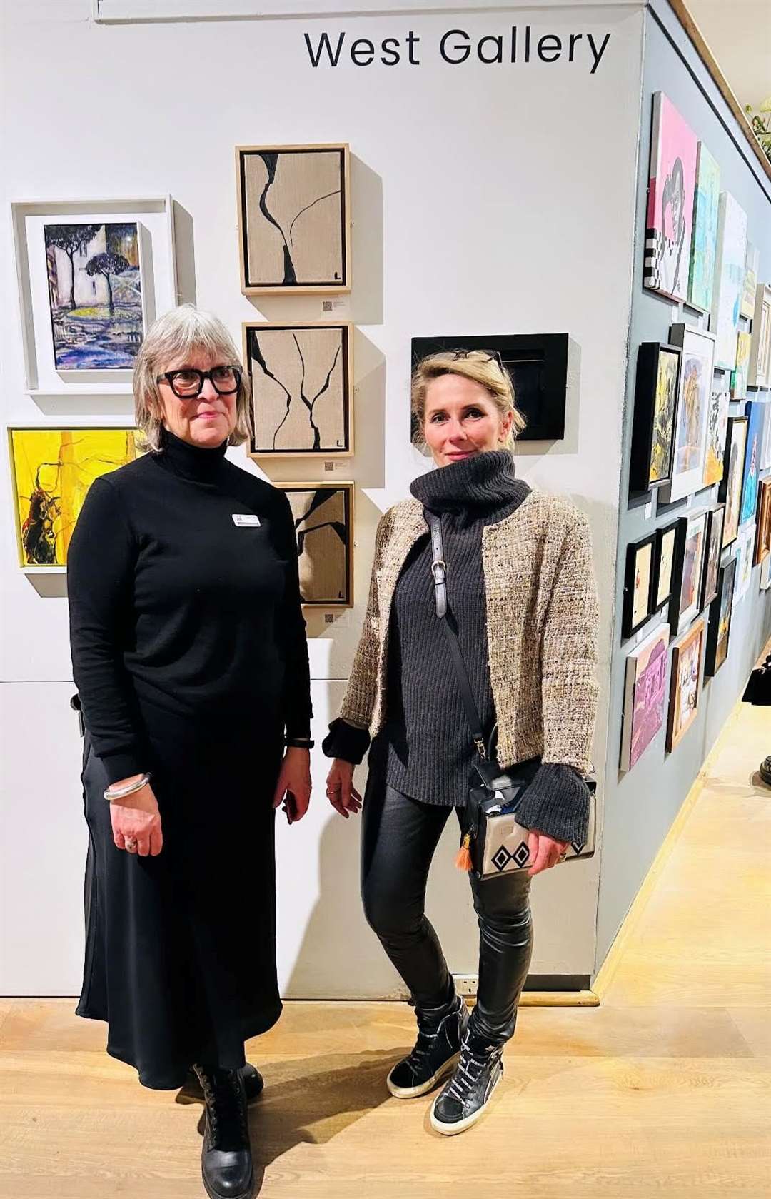 Lenka by her work at the preview at the Mall Galleries with the chair of ING Discerning Eye Sarah Hall