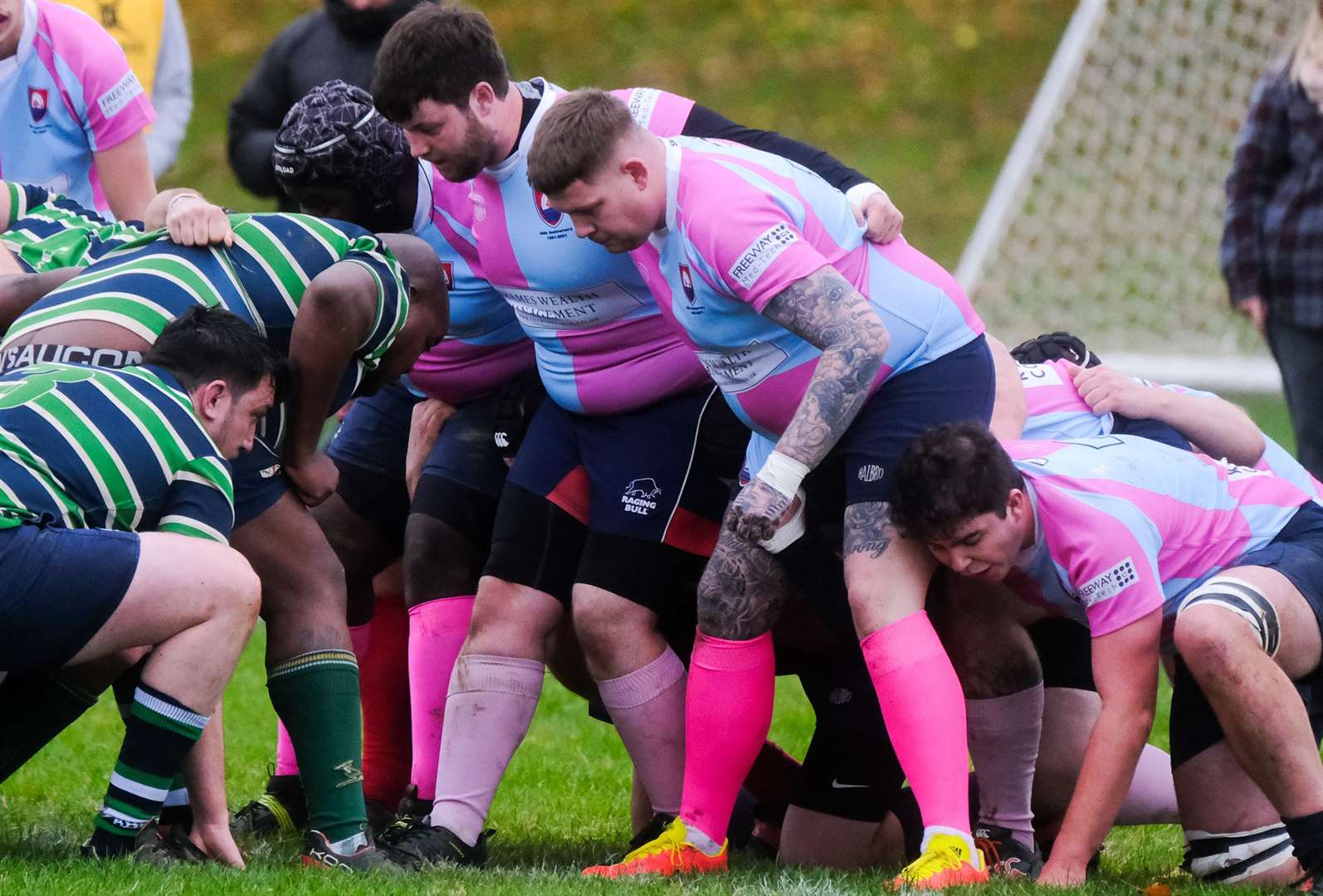 Players from both sides line up for a scrum
