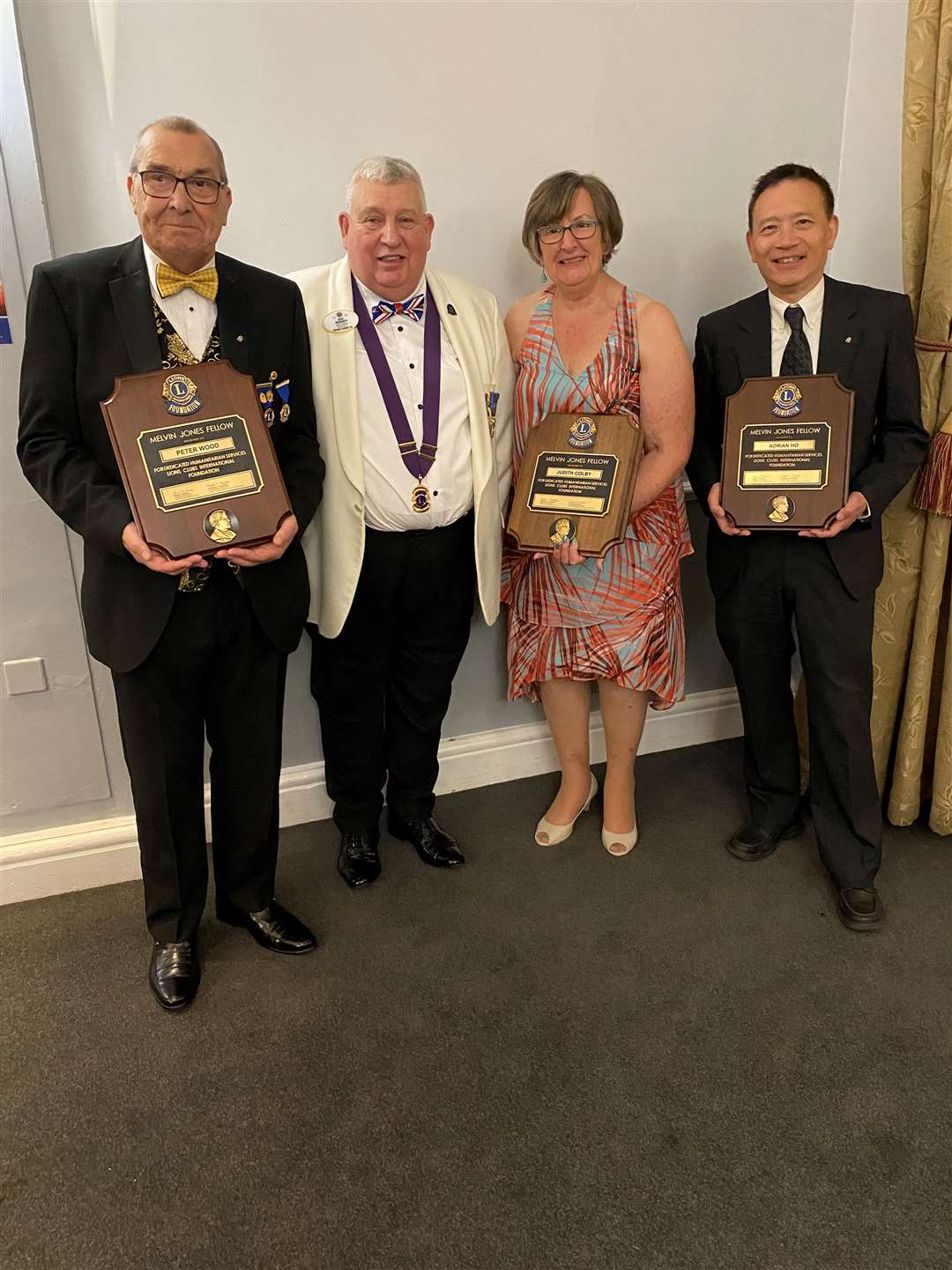 District Governor David Ebsworth with Lions Peter Wood, Judith Colby and Adrian Ho, who were all presented with Melvyn Jones Fellowship awards
