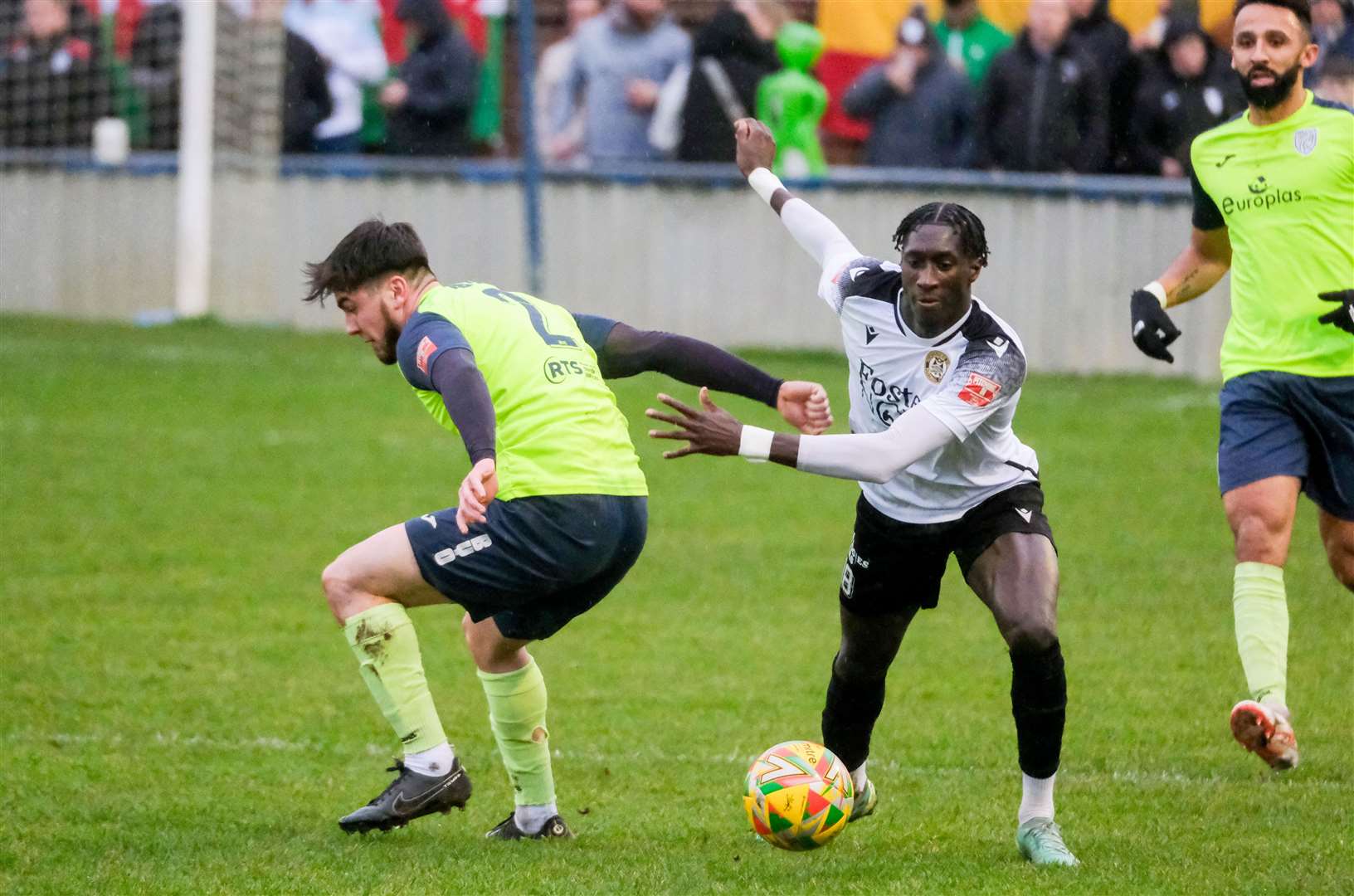 Cheltenham Town loanee Adulai Sambu takes on his man
