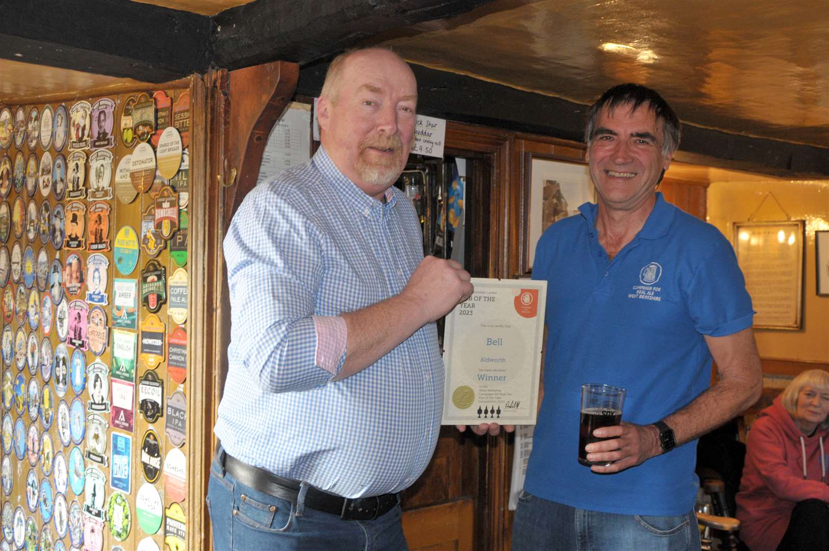 West Berkshire CAMRA chairman Andy Pinkard presents the certificate to landlord Hugh Macaulay, picture: Geoff Fletcher