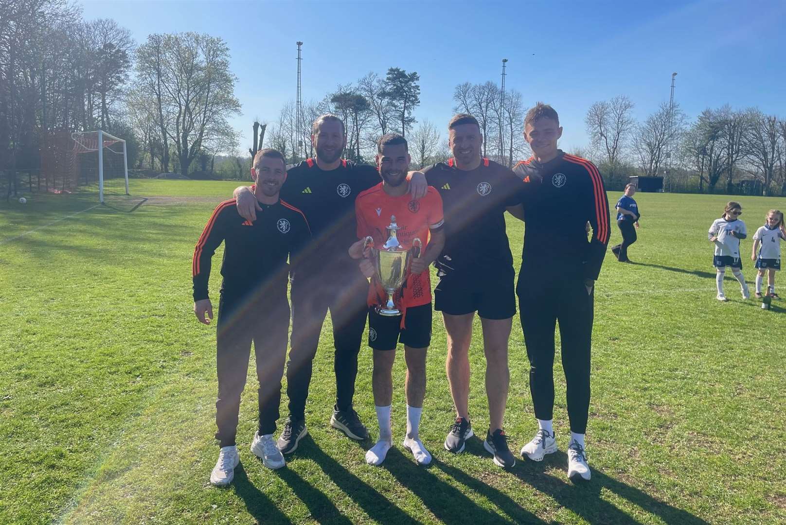Kintbury Rangers' coaching staff and captain with the Wiltshire Senior League title