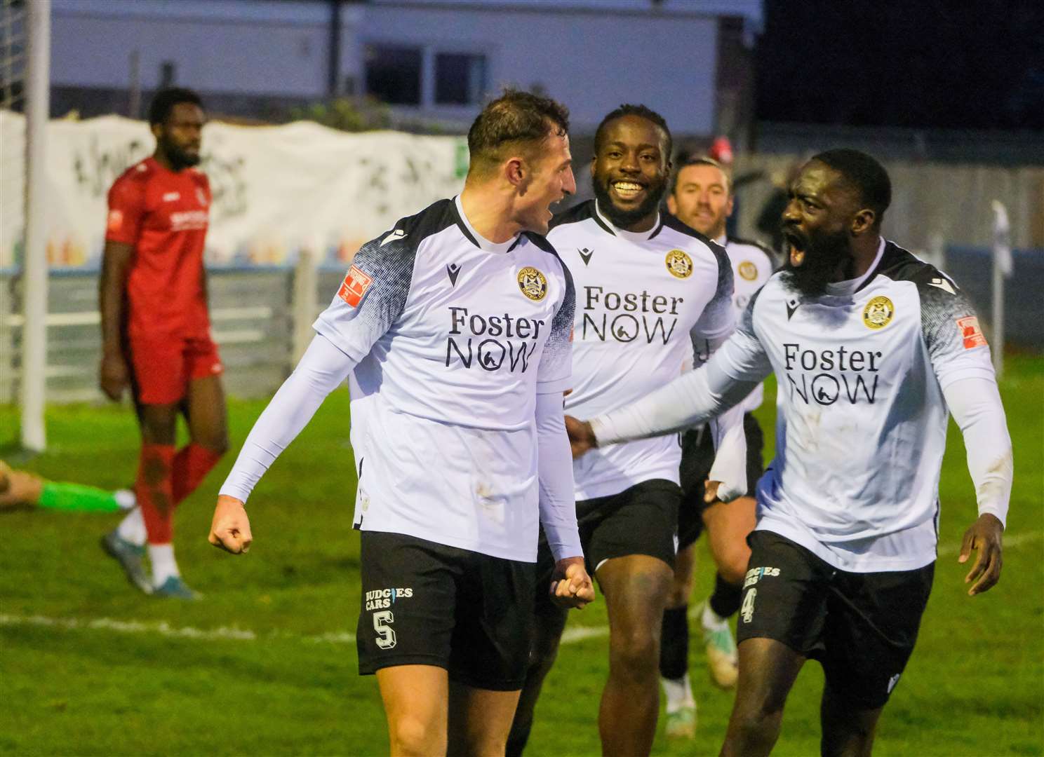 Babs Jarra, Great Evans and Conor McDonagh celebrate with goalscorer Jack Wright