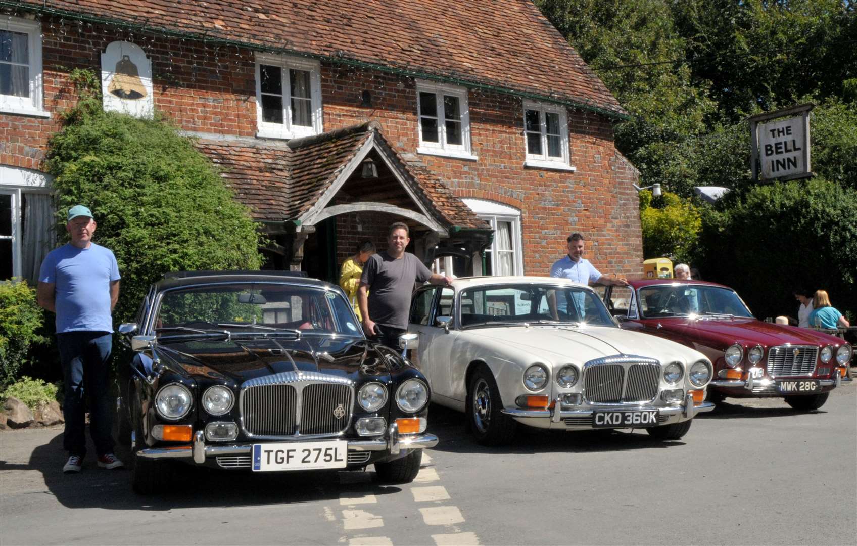 Mark Sutherland, Daimler; Neil Powell, Daimler, and Adrian Massey with his special Jaguar XJ Series 1 Pic: Geoff Fletcher