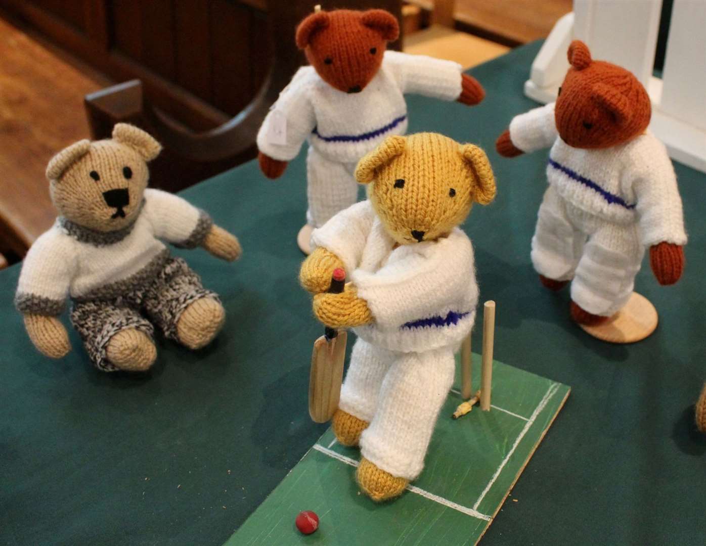 Teddies playing cricket