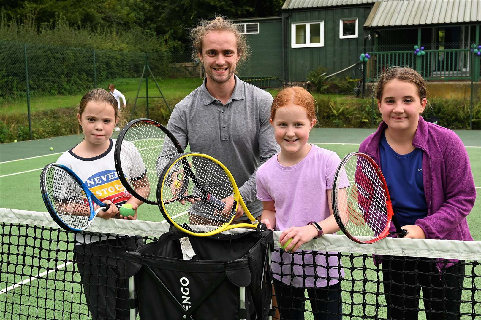 Mike Gordon (coach) with Grace Gibby (10), Josie Foulkes (10), and Sophia Krasteva (10)
