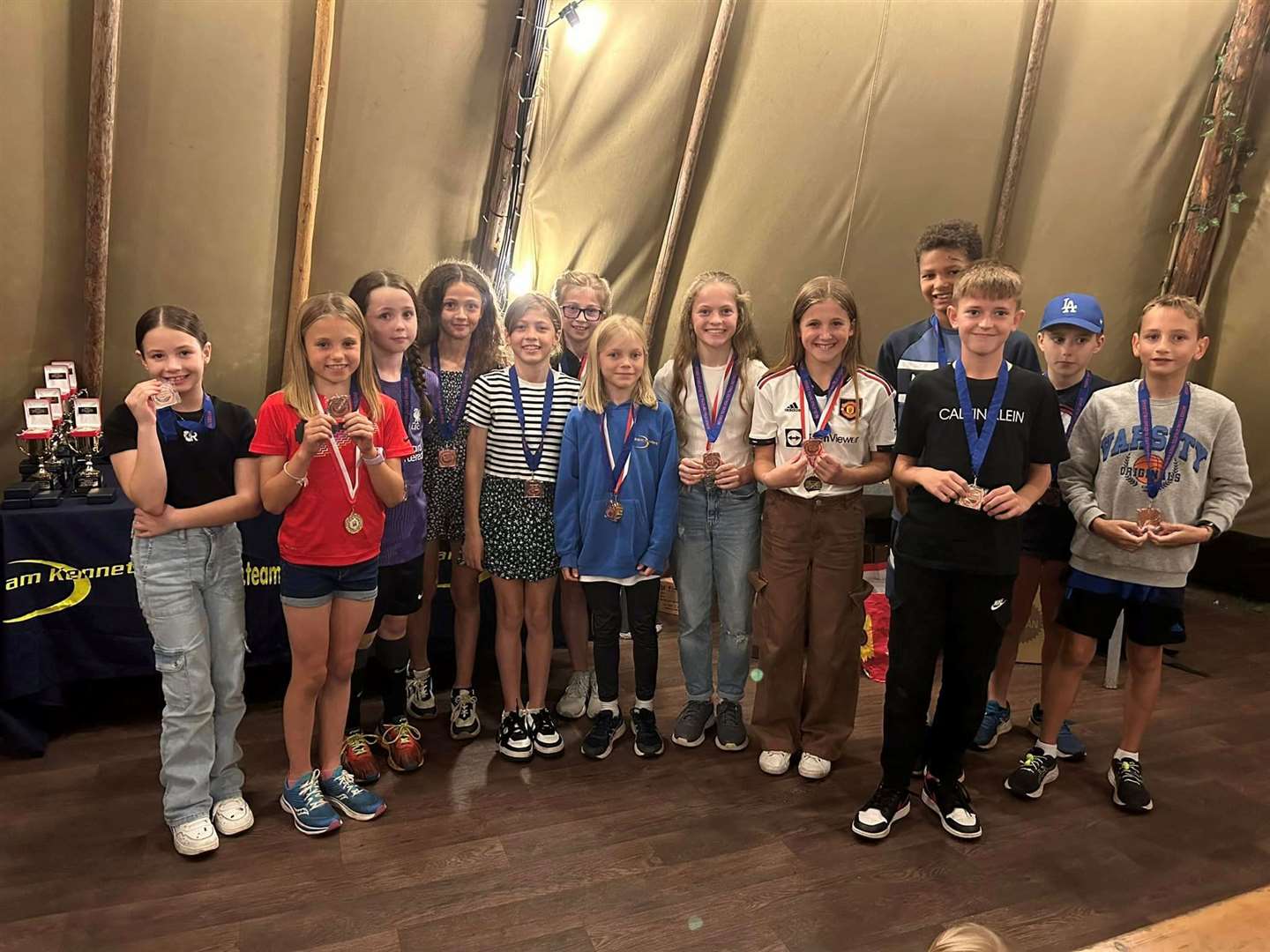 Team Kennet’s under-11 boys and girls with their medals