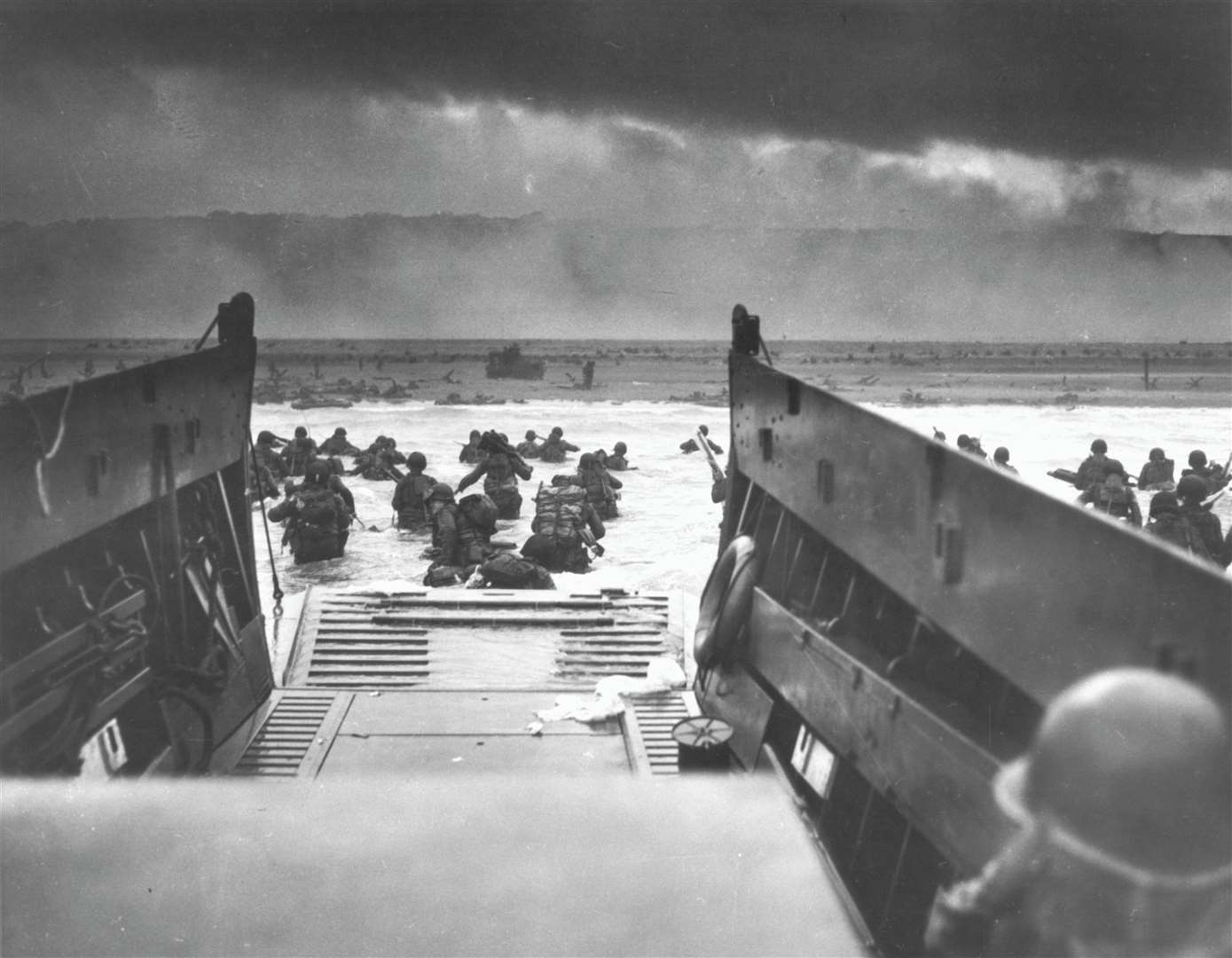 Image 2- US soldiers wade ashore at Omaha Beach during the Normandy landings on June 6, 1944. Public DomainOnline it says: This image or file is a work of a United States Coast Guard service personnel or employee, taken or made as part of that person's official duties. As a work of the U.S. federal government, the image or file is in the public domain (17 U.S.C. § 101 and § 105, USCG main privacy policyand specific privacy policy for its imagery server
