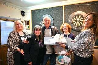 TV star Chris presents Catherine with top Speen Bake Off prize