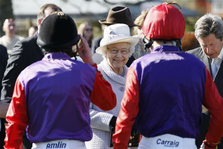 The Queen talking to jockeys in 2013