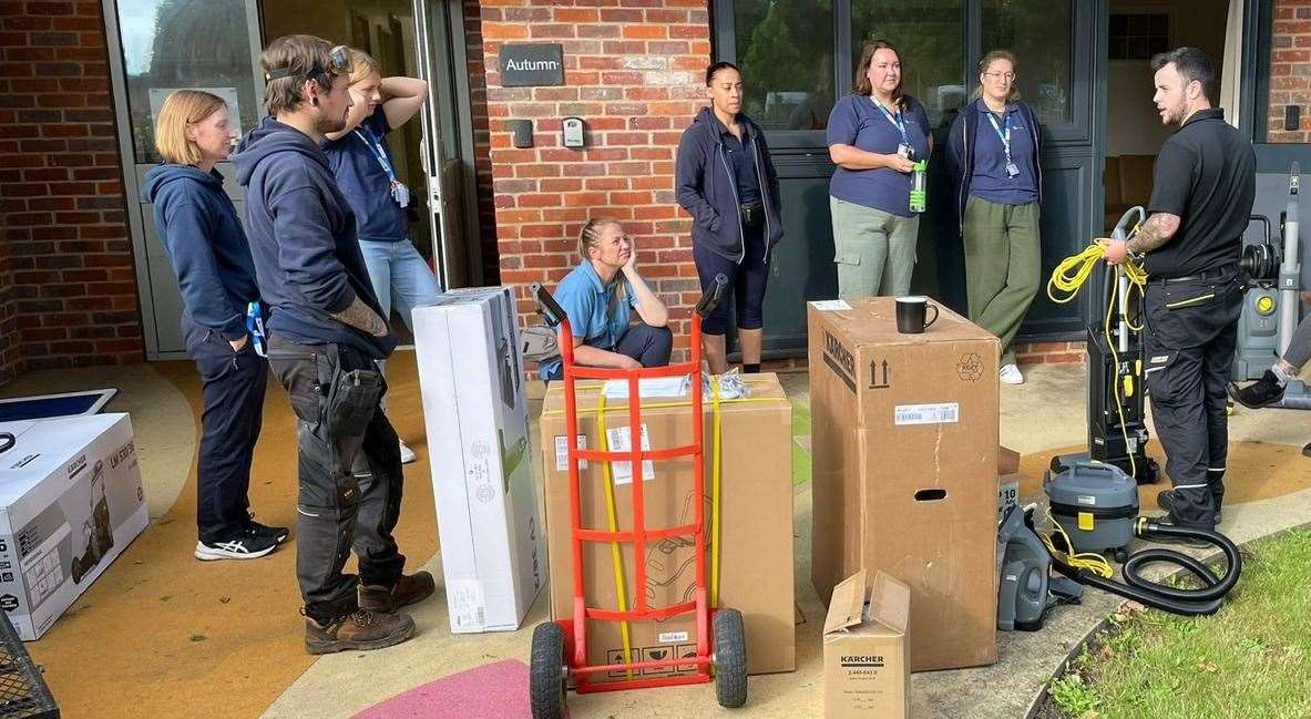 Karcher UK staff give demonstration of their equipment to charity workers