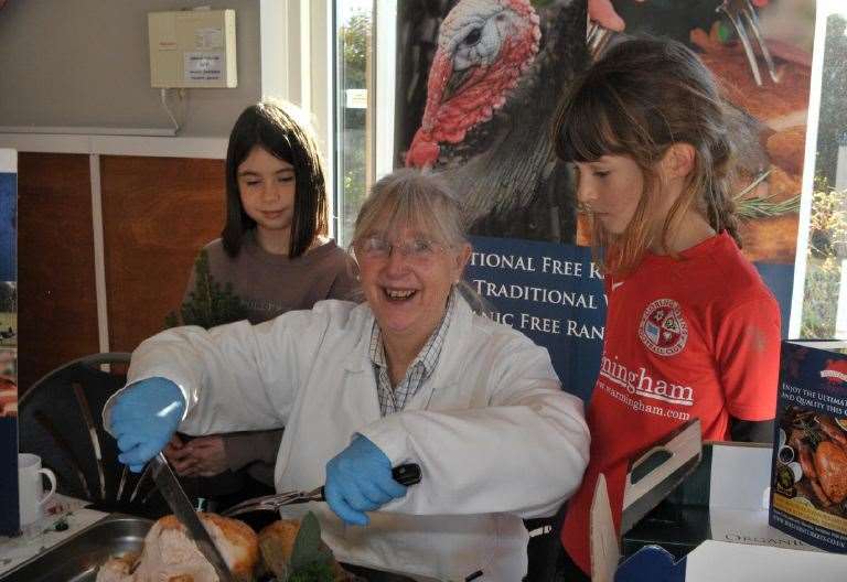 ASM Polly Earnshaw and Amélie Lawrence eagerly await their taste of turkey from Julia Walters of Walters Turkeys Pic: Geoff Fletcher