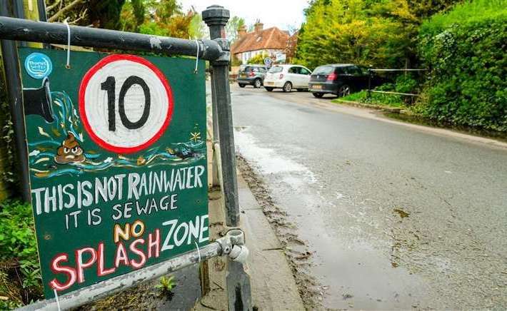 Makeshift signs highlighted the ongoing sewage pollution in Hampstead Norreys last April. Credit: Phil Cannings