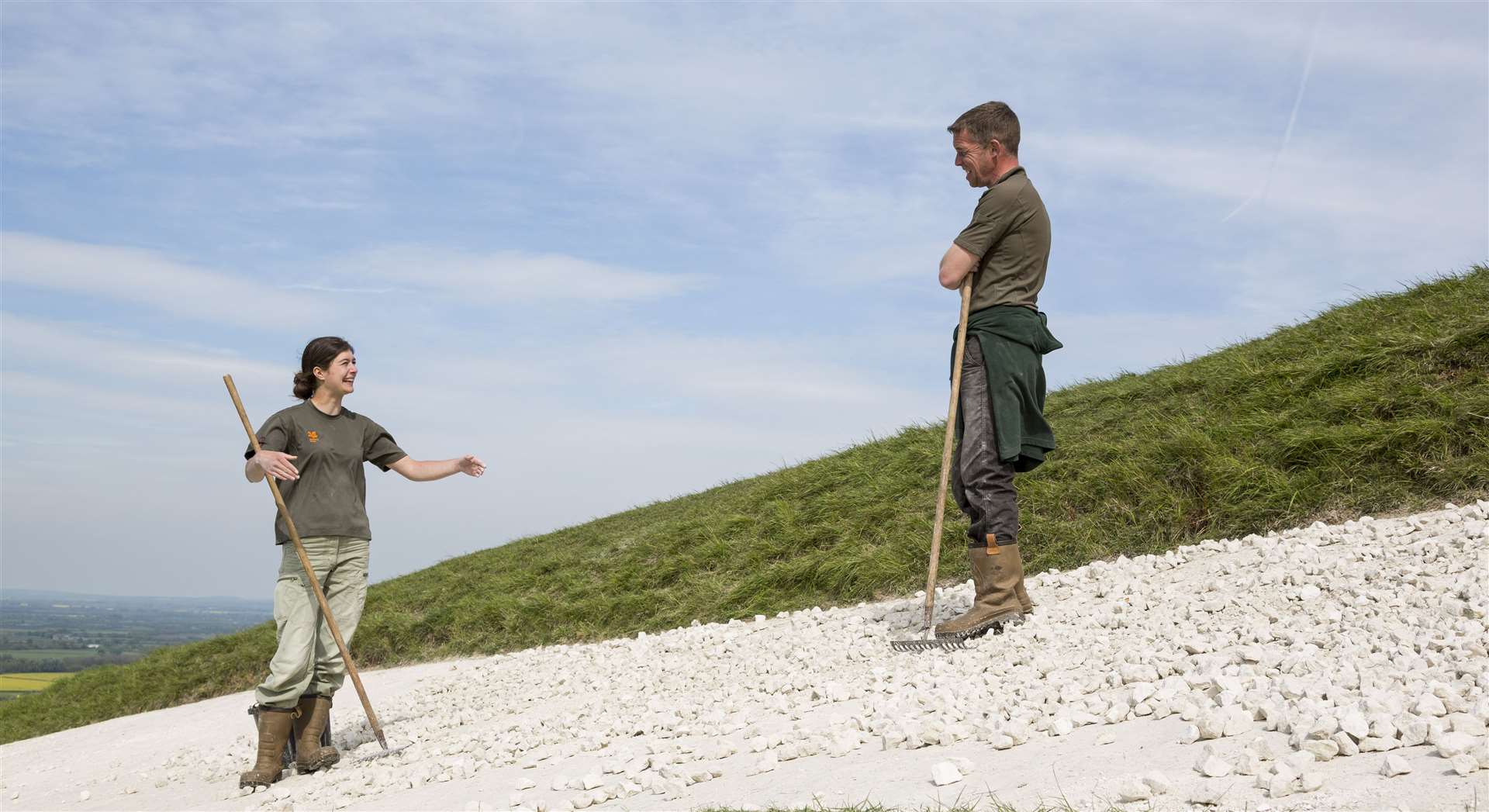 Volunteers scouring the chalk horse at White Horse Hill, Uffington