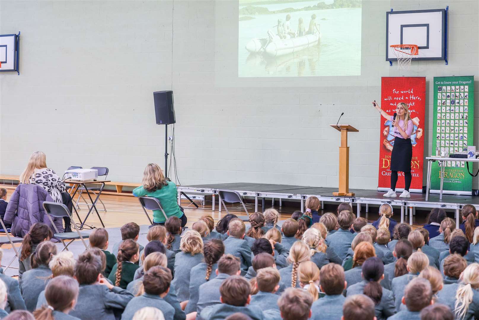 Cressida Cowell, author and the illustrator of the bestselling How to Train Your Dragon book series, gives a talk to 500 primary school pupils in West Berkshire