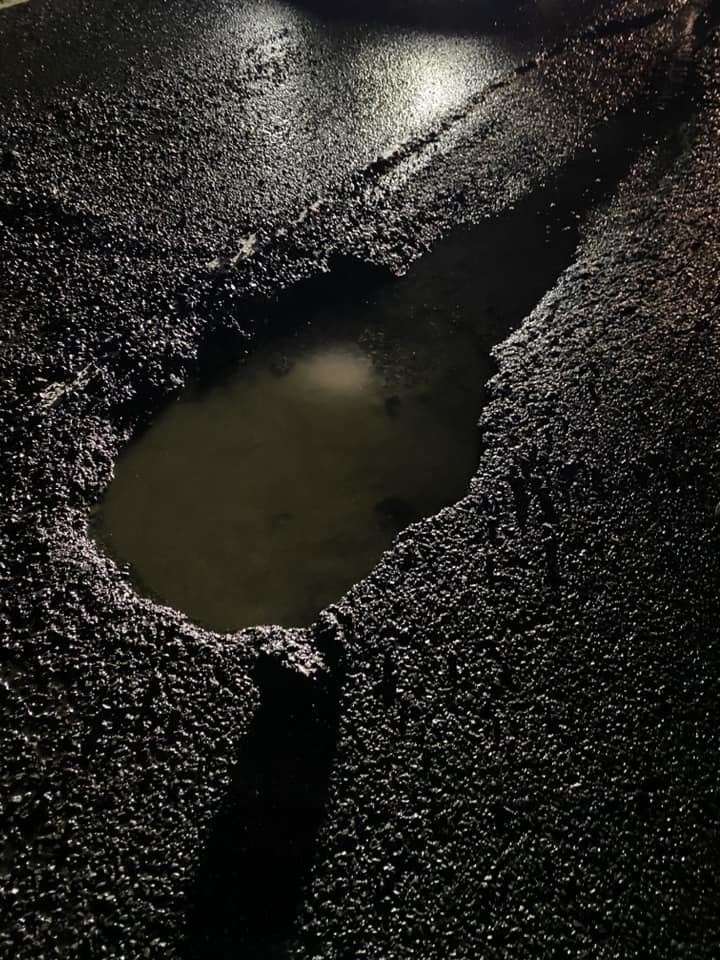 A picture of the pothole taken last night before it was repaired, credit: John Bonas