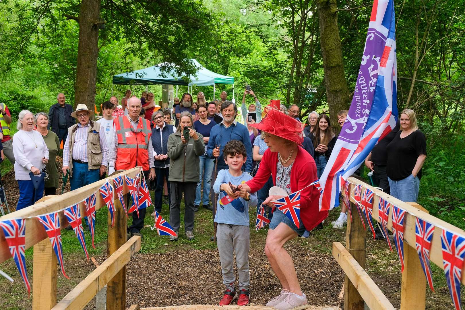 Pat Owen opens the new bridge with help from Felix Roe