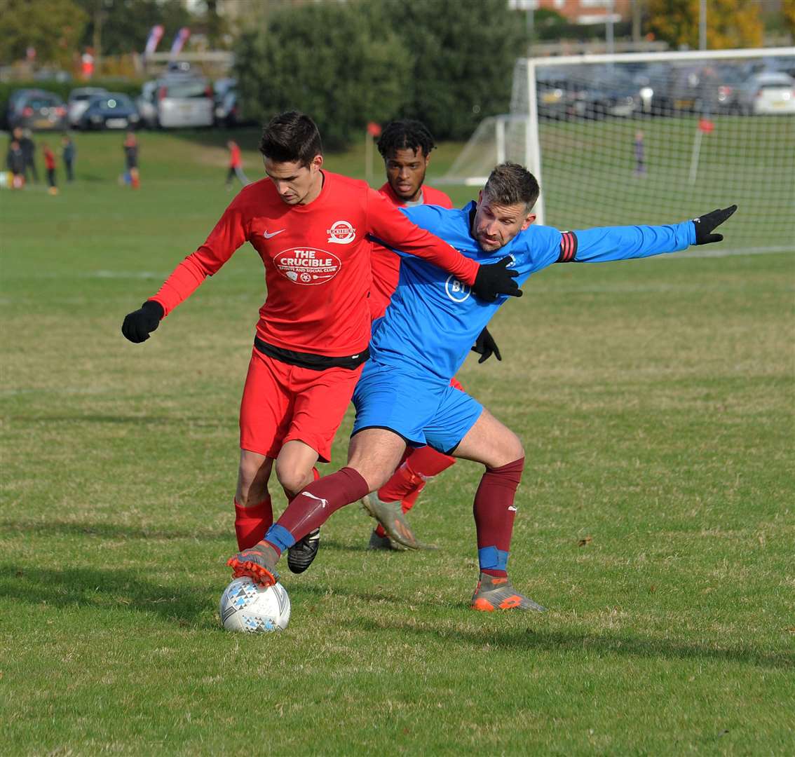 Two players fight for possession