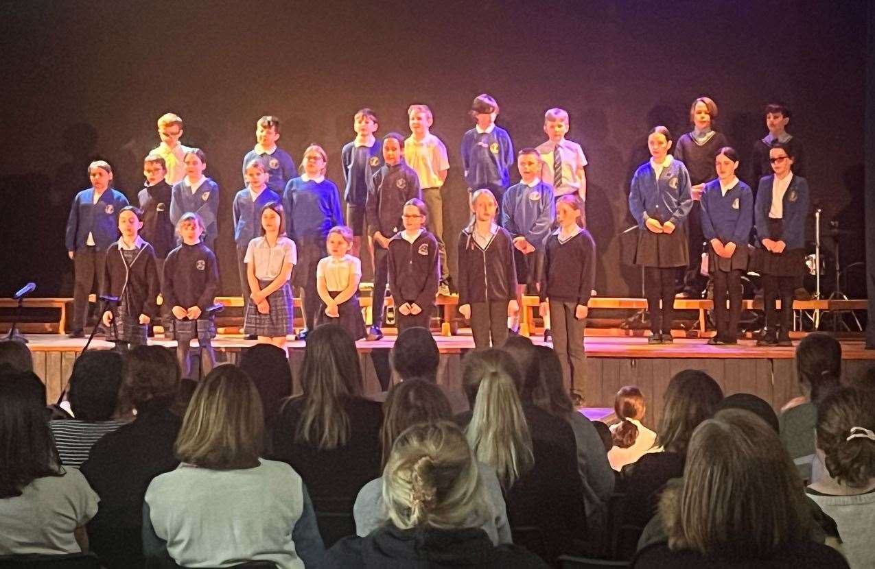 Parents enjoying the pupils' singing in the grand finale. Image supplied by The Downs School