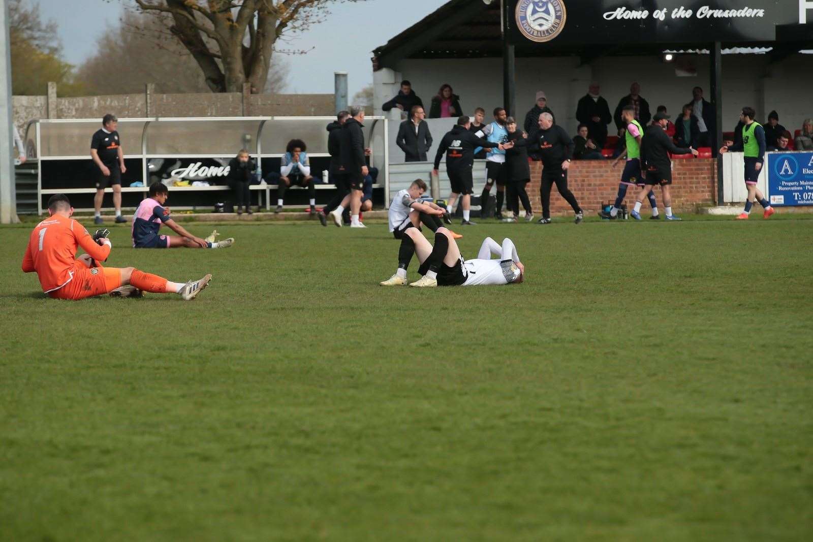 Hungerford’s players are distraught after the full time whistle confirms their relegation. Picture by Jeff Youd