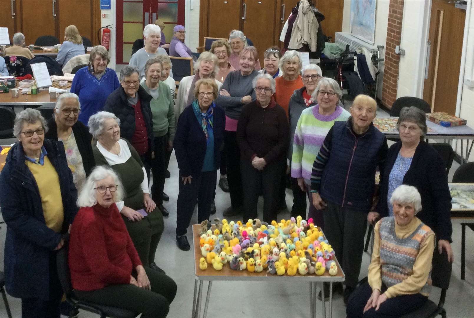 Members of the Warm Welcome group with the 130 chicks and rabbits they knitted