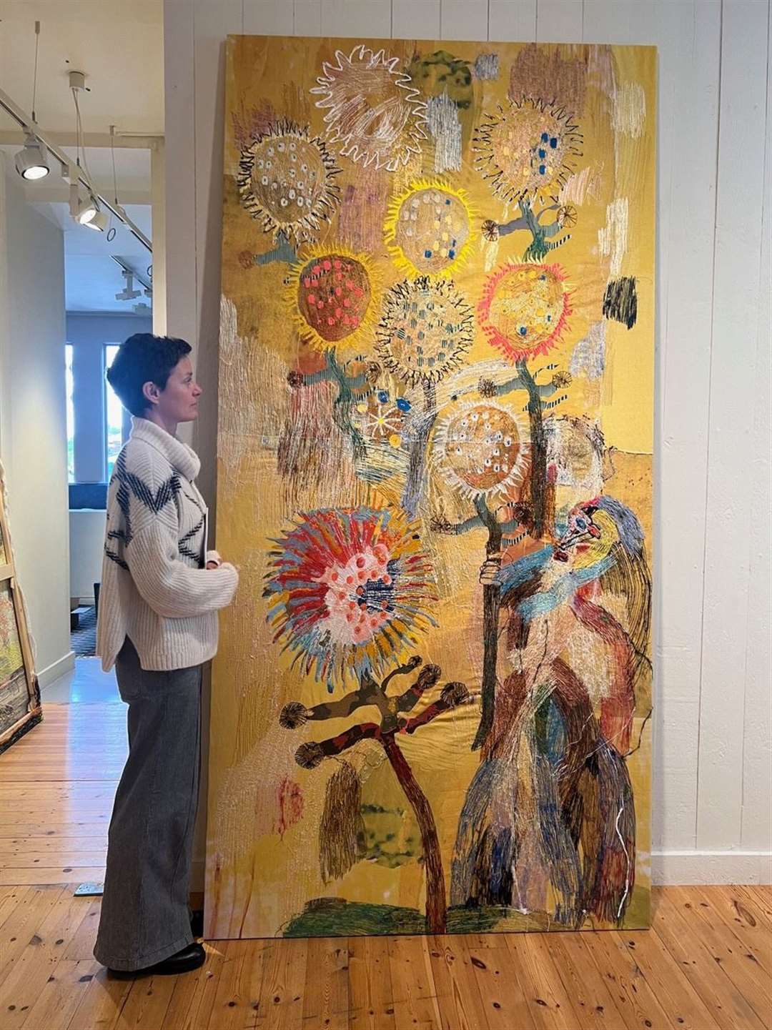 Visitor views Alice Kettle 'Sunflowers'