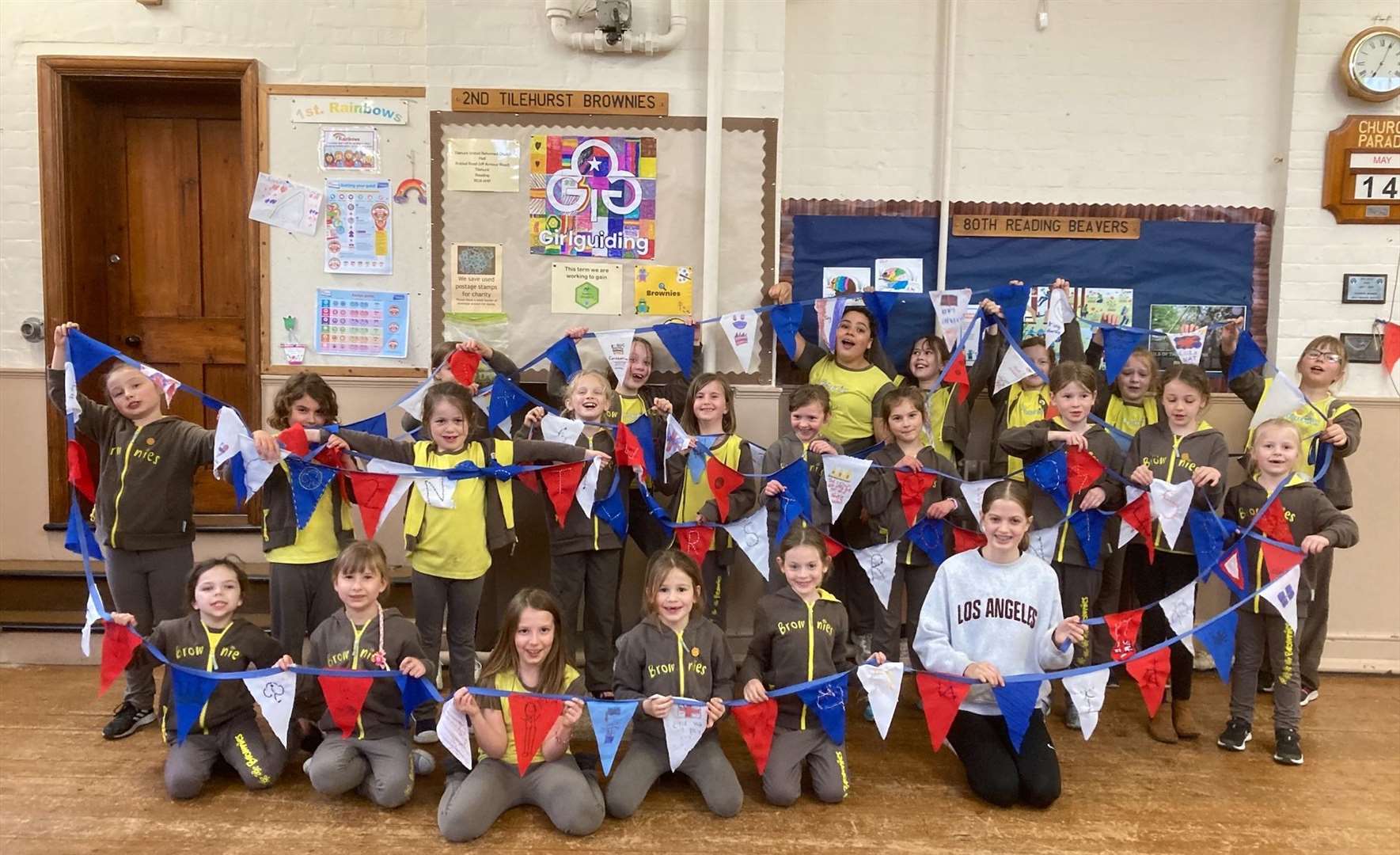 2nd Tilehurst Brownies showing off their Coronation bunting