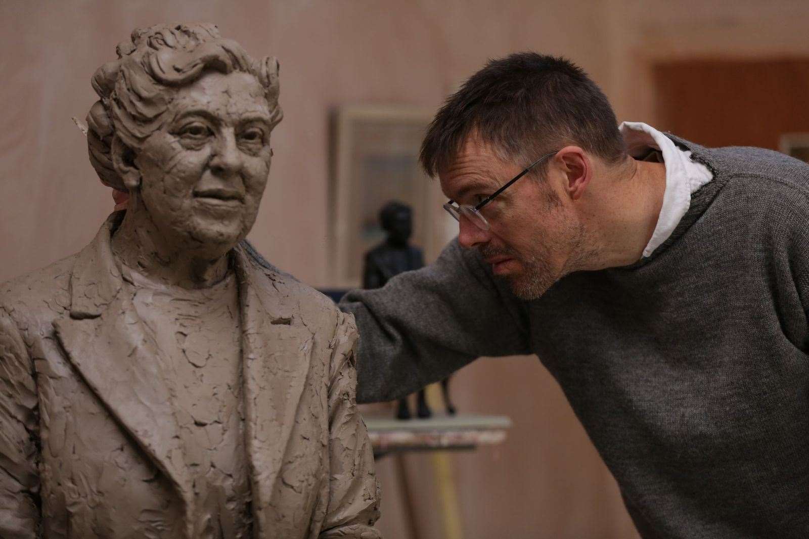 Figurative sculptor Ben Twiston-Davies working on the statue