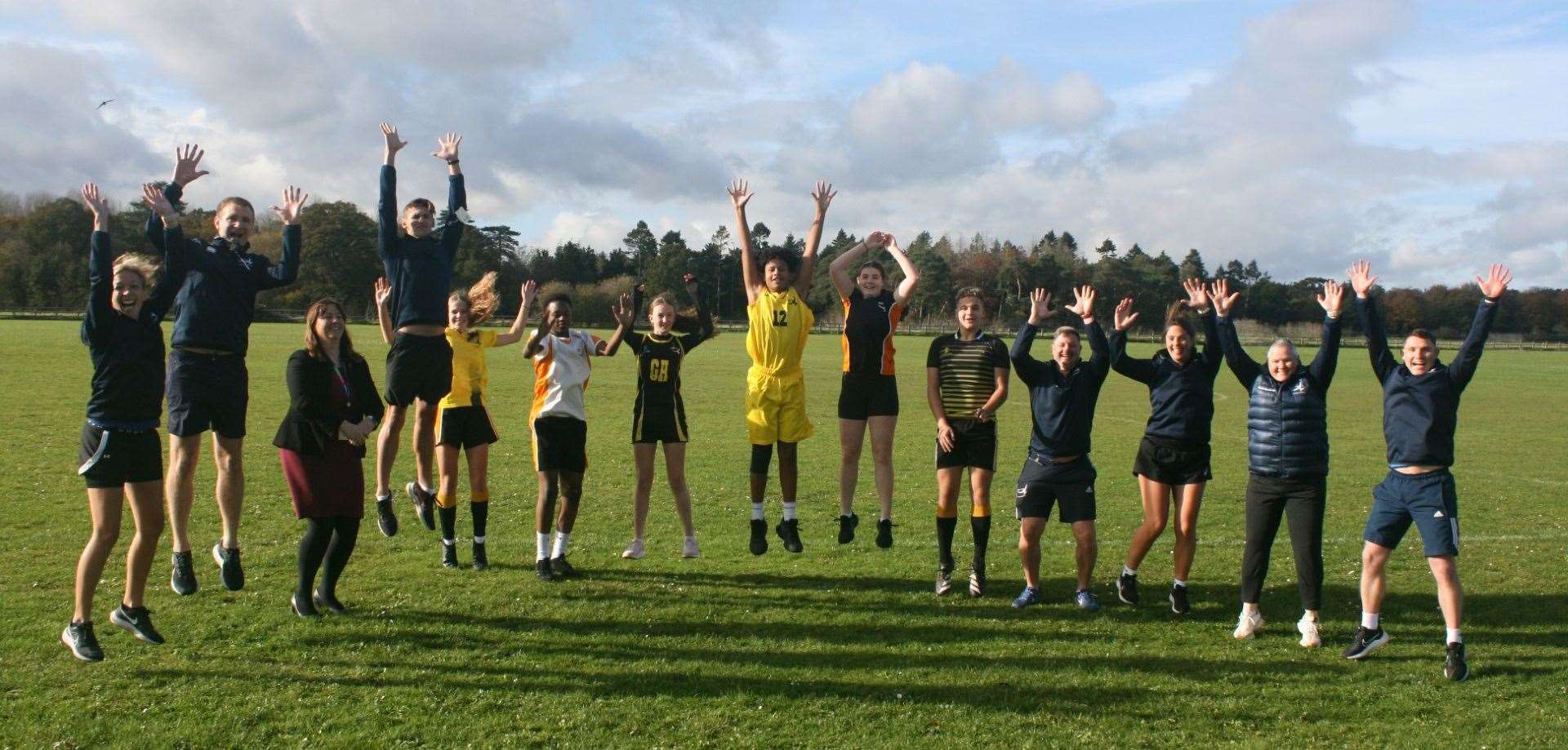 Staff and pupils celebrating their award win