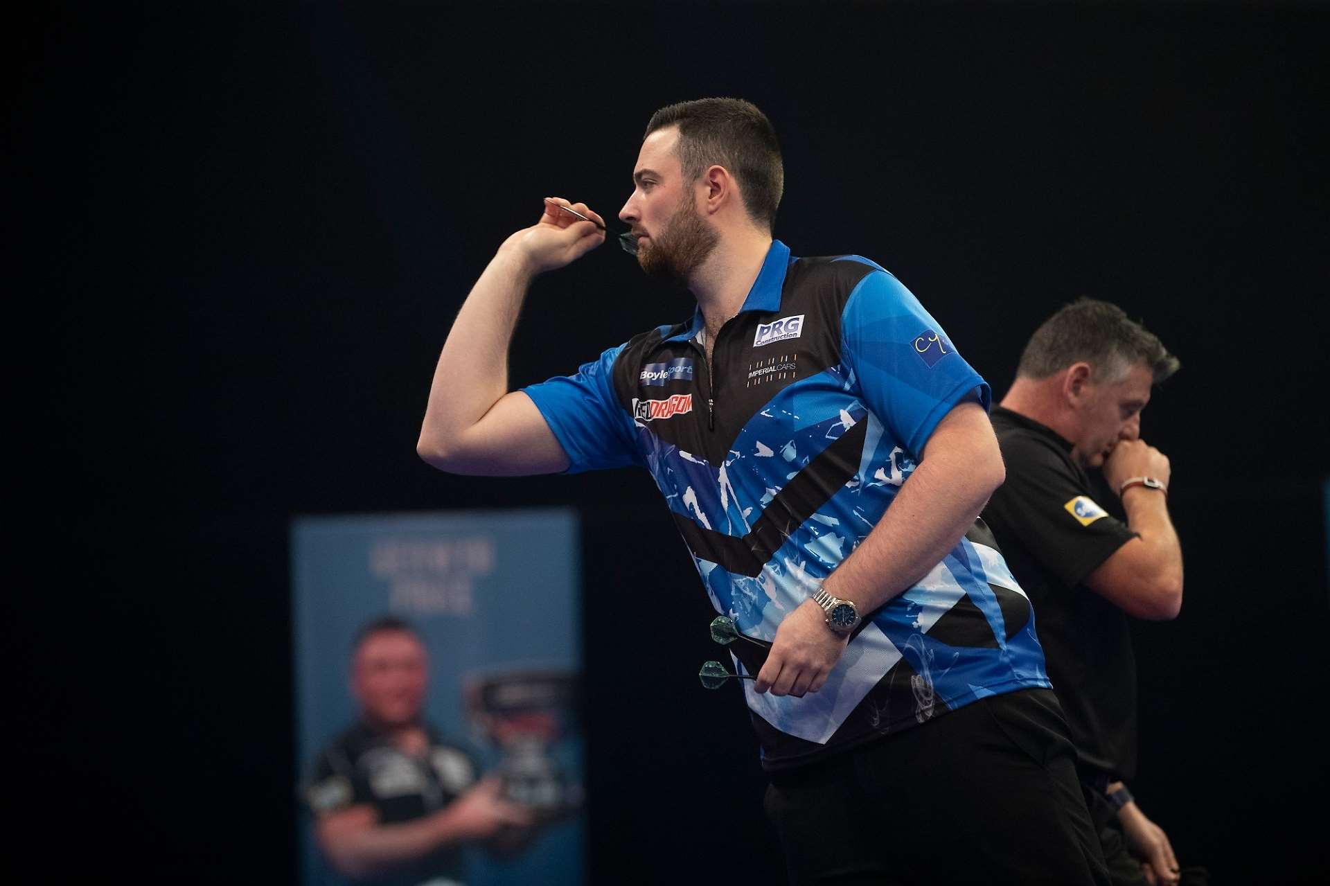Luke Humphries in action against Justin Pipe - Credit: Lawrence Lustig/PDC