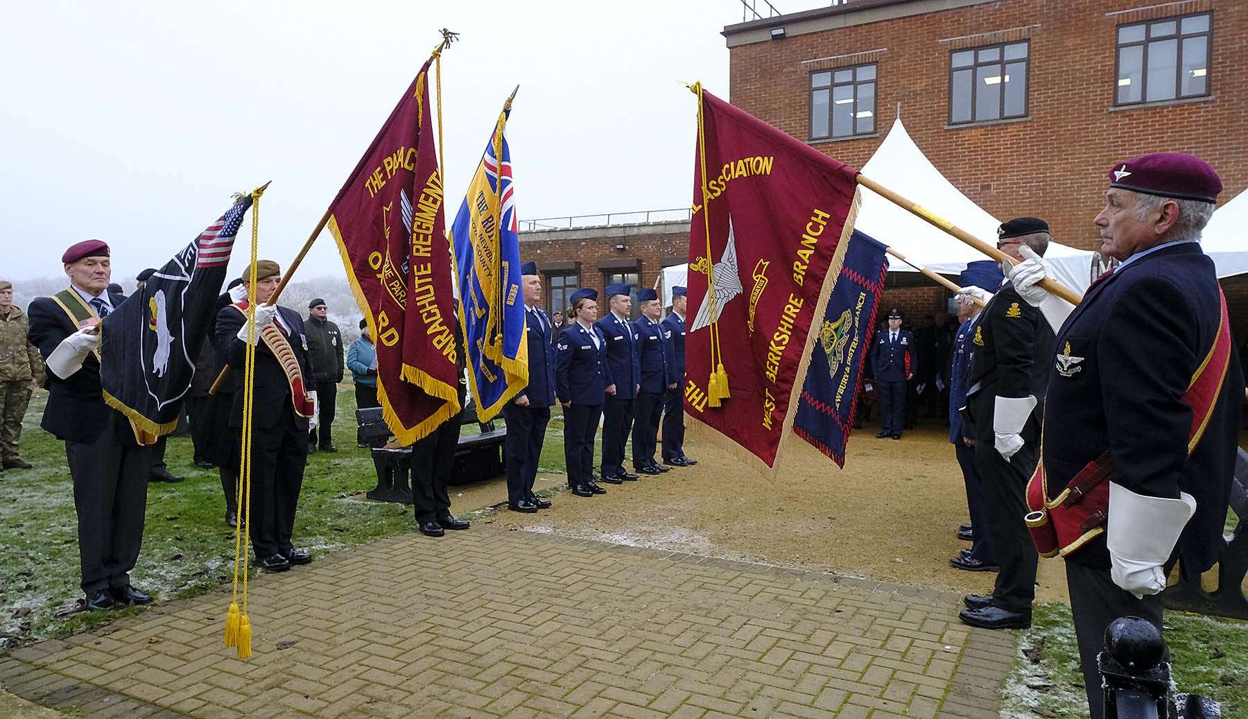 Honour guard stand in memory of the 49 American airmen killed in two aircraft accidents in 1944