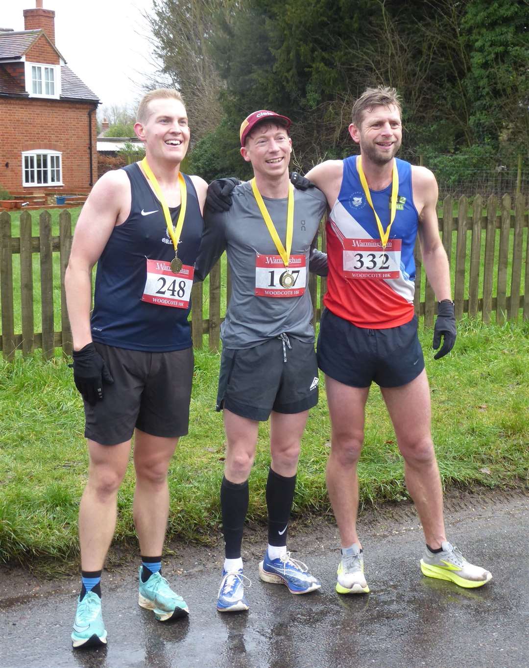 First place Harry Pettingell, middle, second place Aaron Burgess, right, and third place Lachlan Arthur with their medals, presented at the finish line by sponsor Bob Warmingham