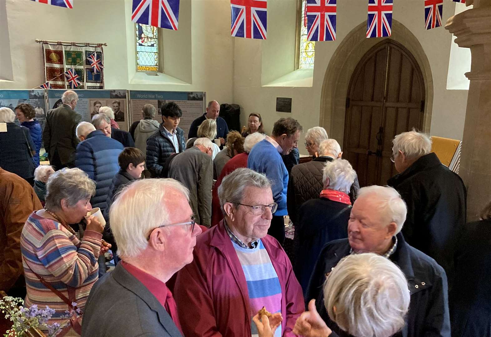Congregation inside the church, adorned with VE Day bunting