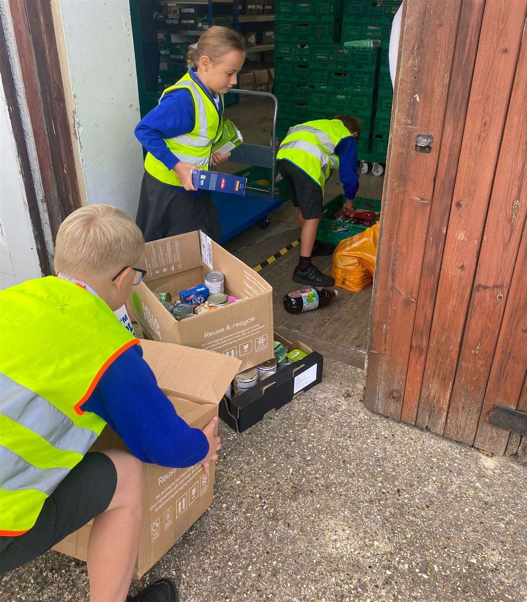 Bradfield pupils carry their donations into West Berks Food Bank