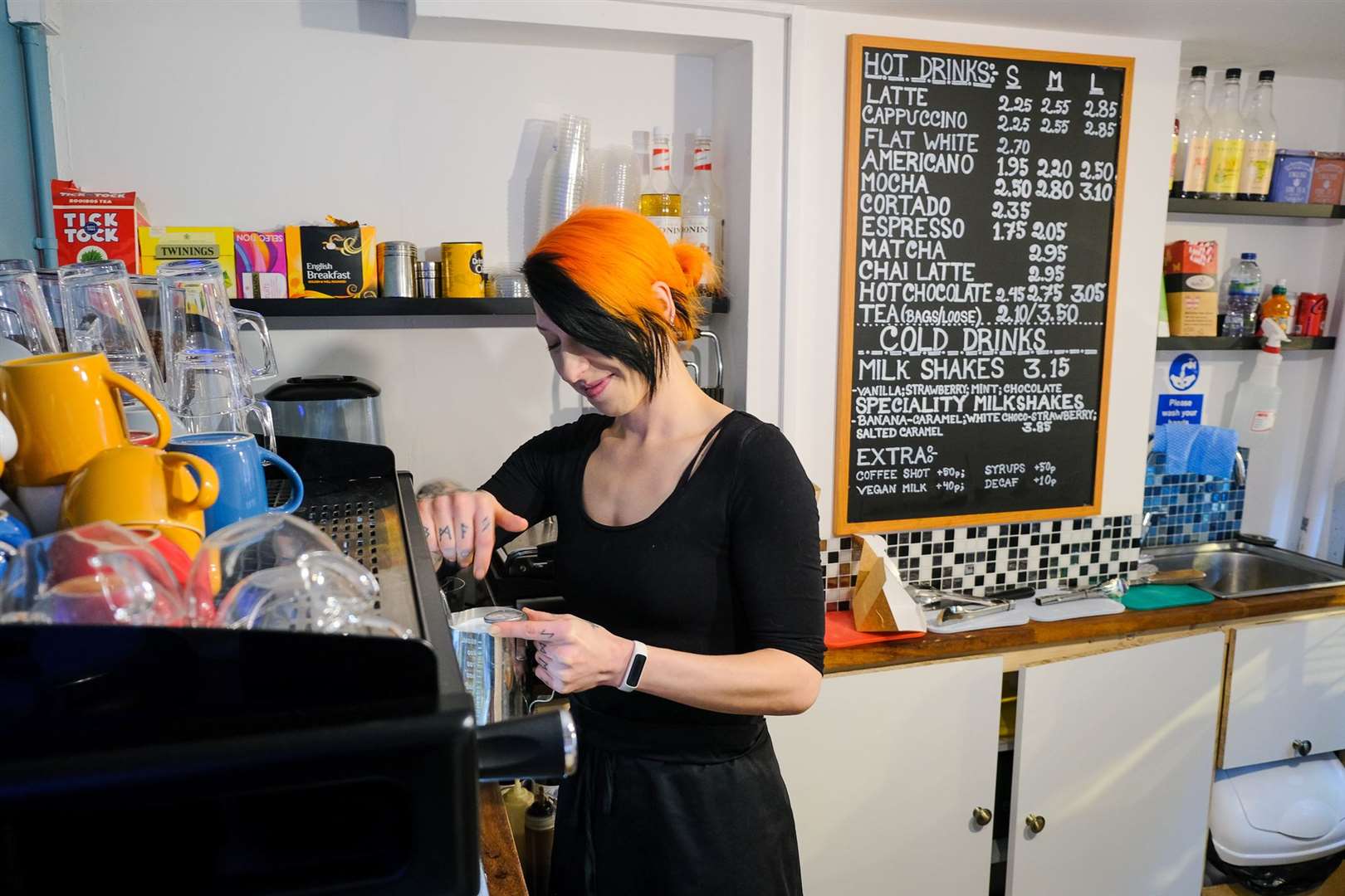 Paige prepares some coffee