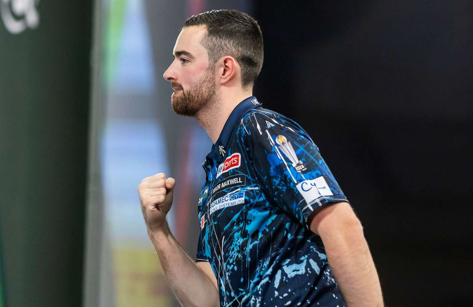 Luke Humphries opened his World Championship title defence with a routine win - Photo: PDC