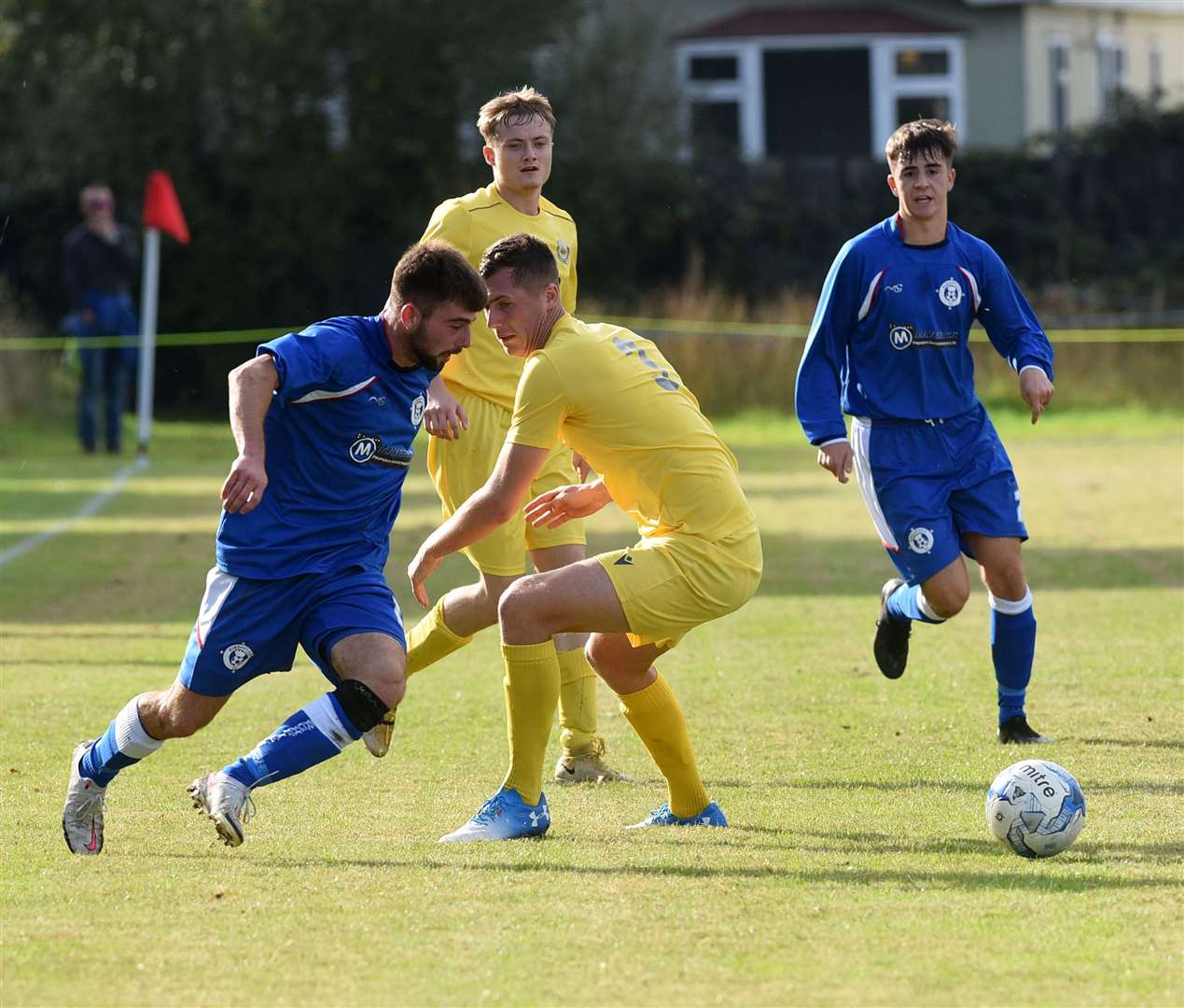 The Burghfield player has the ball