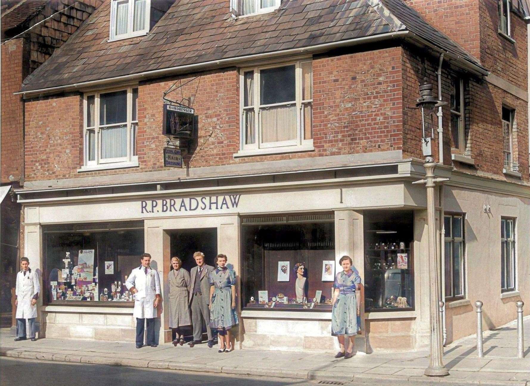 Robert Percy Bradshaw and his wife stood centre with their workers. Credit: Jim Bradshaw
