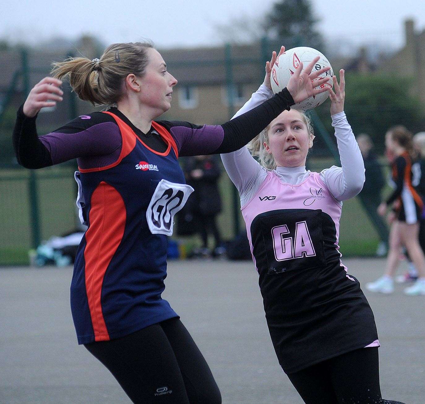 One player attempts to intercept the ball
