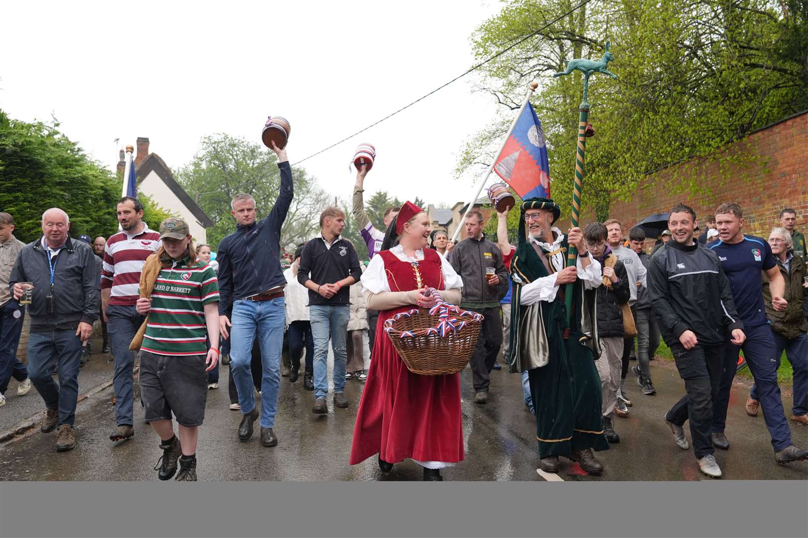 A hare pie was paraded to the church gates ahead of the annual bottle kicking (Joe Giddens/PA)