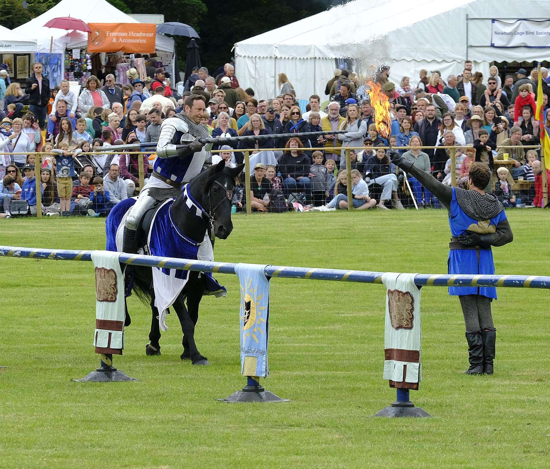 The Duke of Newbury takes the flame